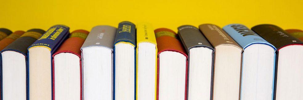 row of books. Research-References-that-inform-our-work